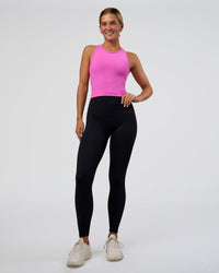 Woman wearing Flow Performance Tank 2.0 - Ultra Fuchsia | Model:Amity | Size:S