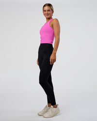 Woman wearing Flow Performance Tank 2.0 - Ultra Fuchsia | Model:Amity | Size:S
