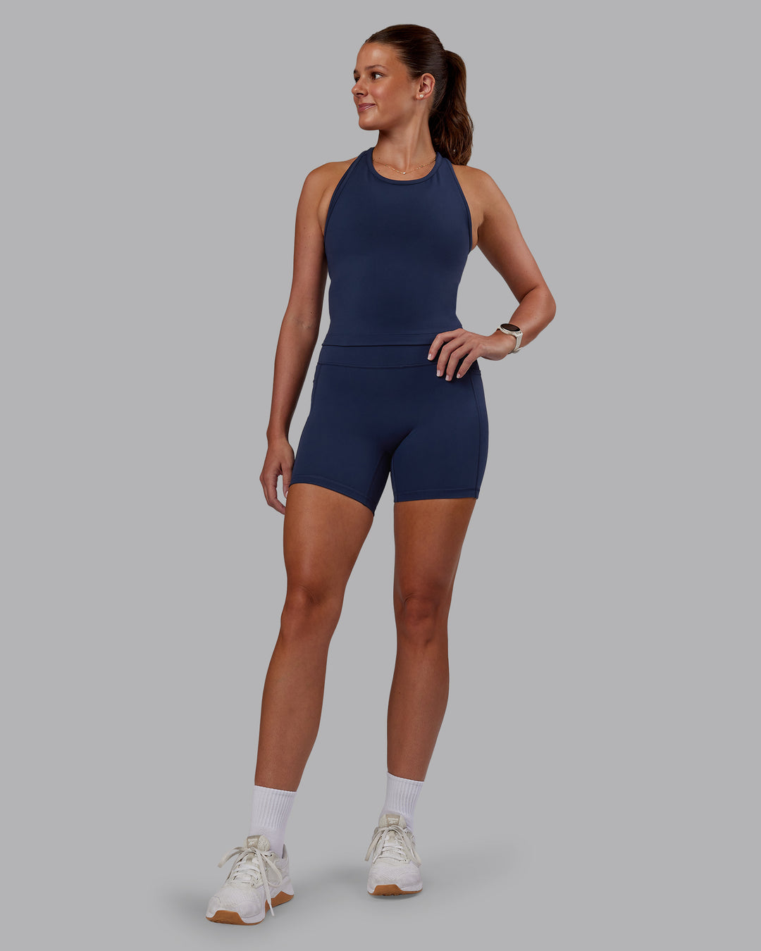 Woman wearing Flow Performance Tank - Future Navy | Model:Phoebe | Size:S