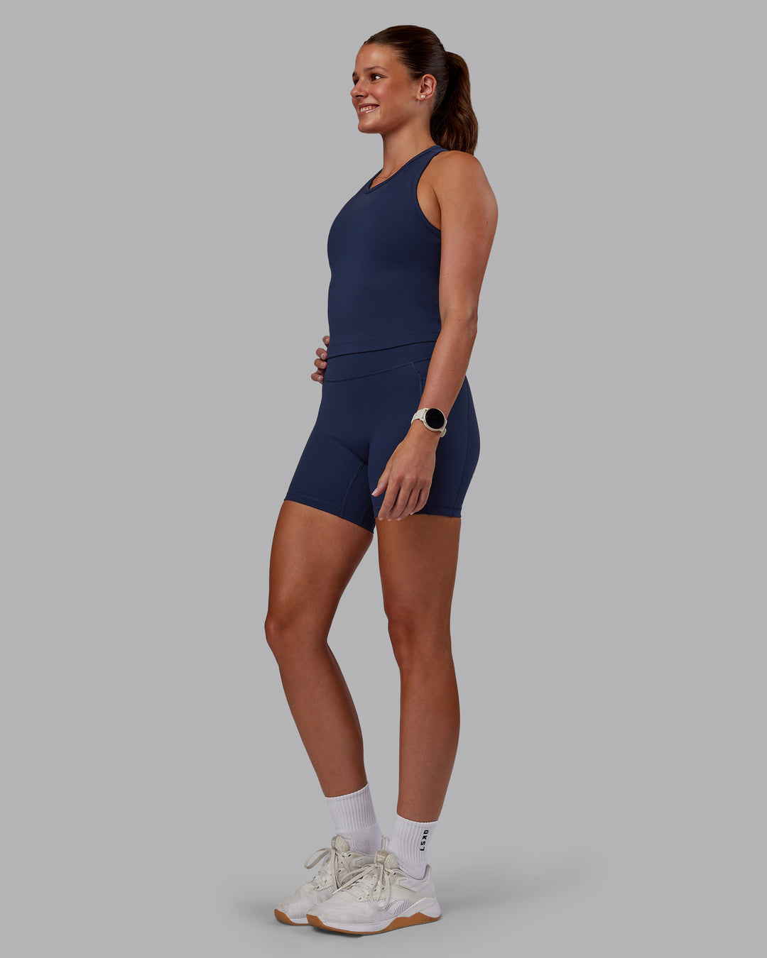 Woman wearing Flow Performance Tank - Future Navy | Model:Phoebe | Size:S