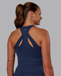 Woman wearing Flow Performance Tank - Future Navy | Model:Phoebe | Size:S