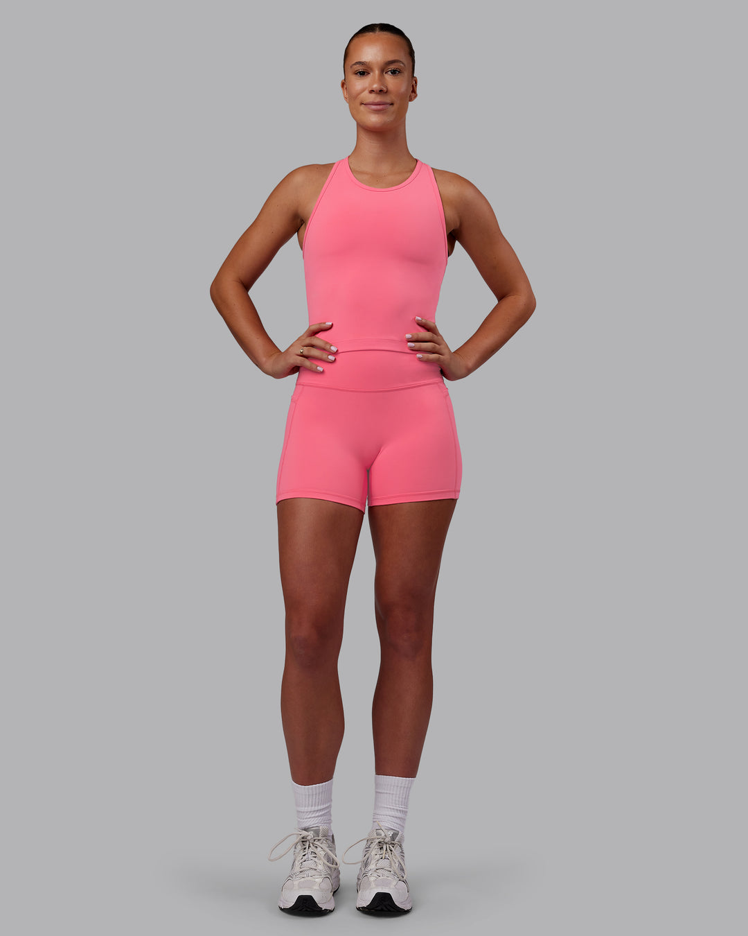 Woman wearing Flow Performance Tank - Pink Lemonade | Model:Charlize | Size:S