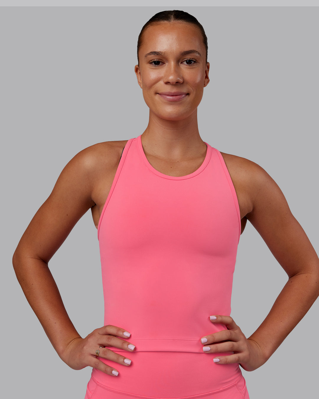 Woman wearing Flow Performance Tank - Pink Lemonade | Model:Charlize | Size:S
