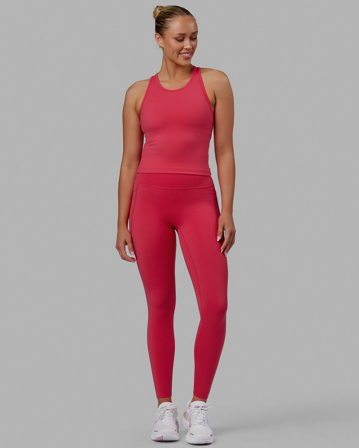 Woman wearing Flow Performance Tank - Raspberry