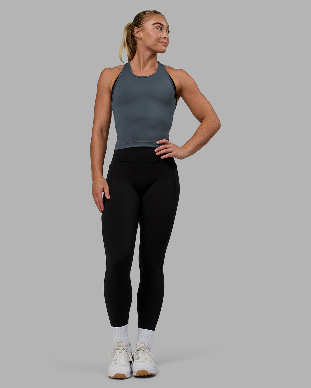 Woman wearing Flow Performance Tank - Turbulence