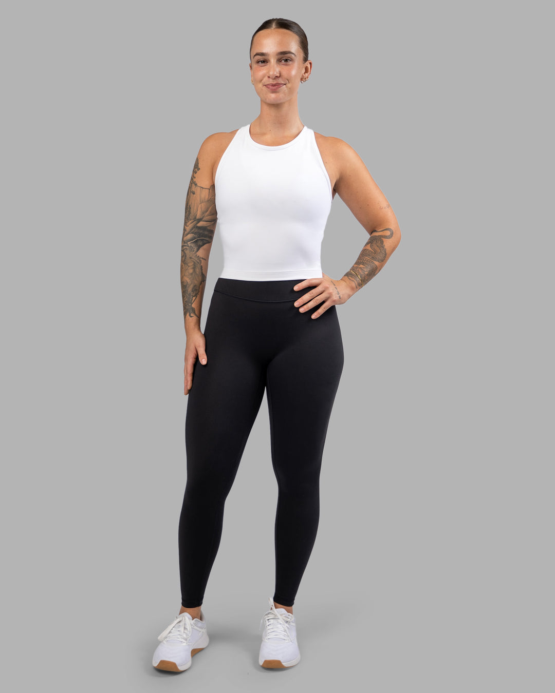 Woman wearing Flow Performance Tank - White | Model:Robyn | Size:S