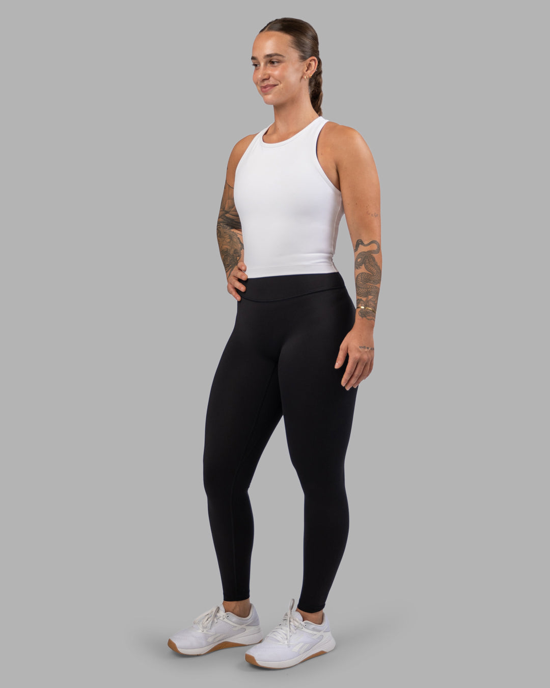 Woman wearing Flow Performance Tank - White | Model:Robyn | Size:S