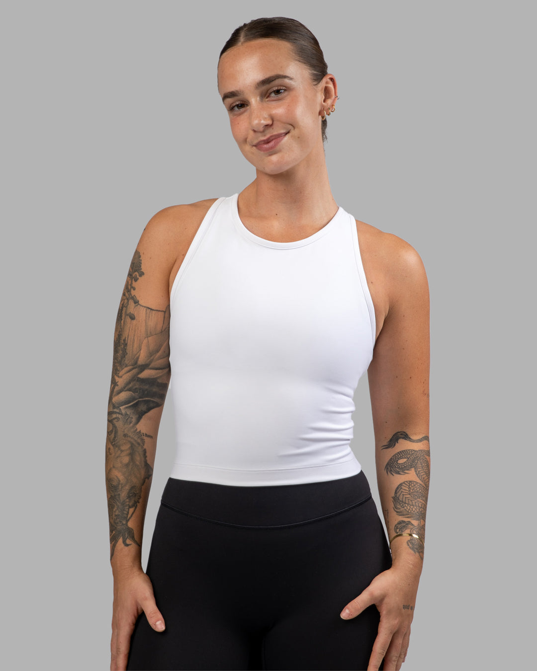Woman wearing Flow Performance Tank - White | Model:Robyn | Size:S
