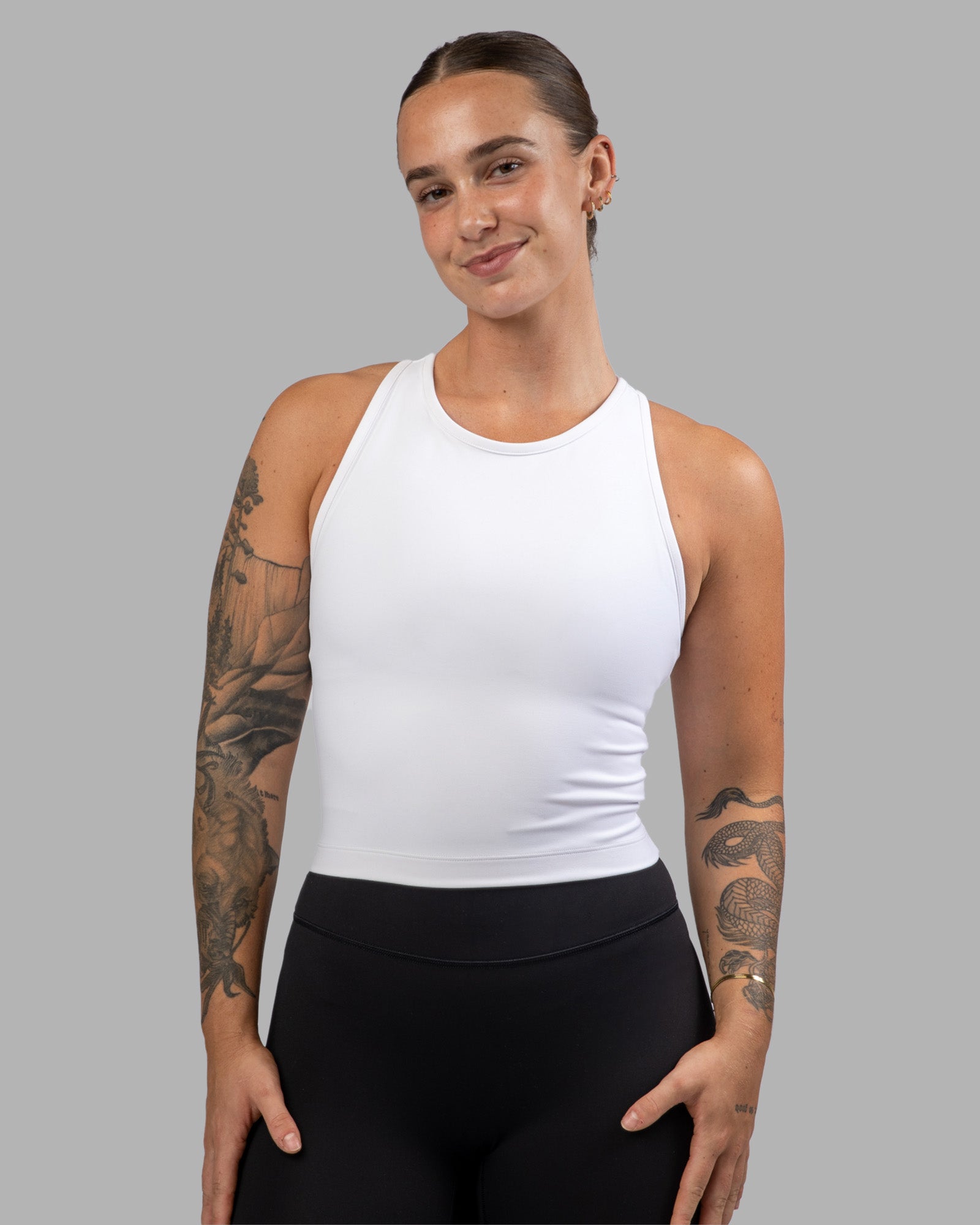 Woman wearing Flow Performance Tank - White | Model:Robyn | Size:S