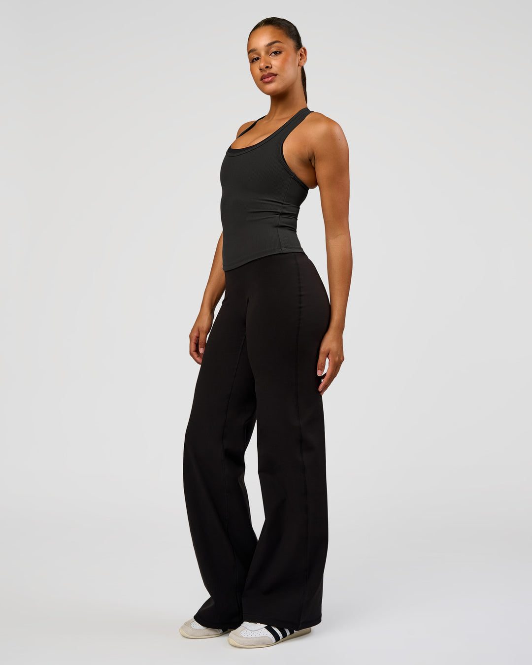 Woman wearing Flow Rib Scoop Neck Tank - Onyx | Model:Rosie | Size:S