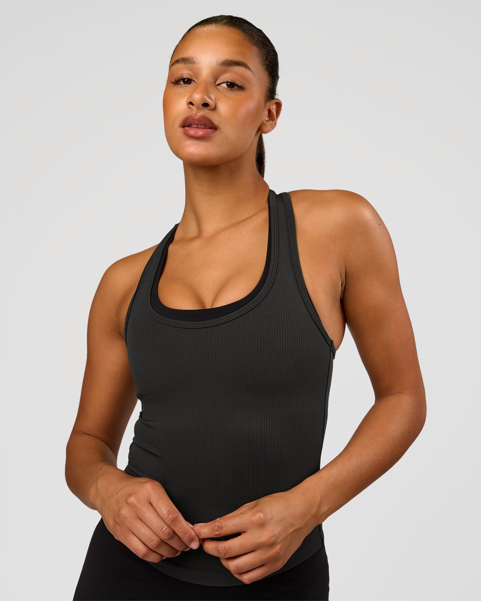 Woman wearing Flow Rib Scoop Neck Tank - Onyx | Model:Rosie | Size:S