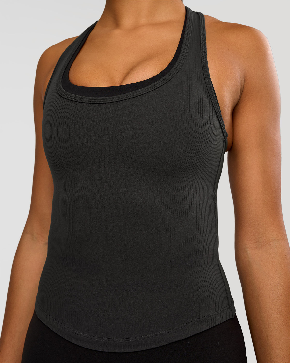 Woman wearing Flow Rib Scoop Neck Tank - Onyx | Model:Rosie | Size:S