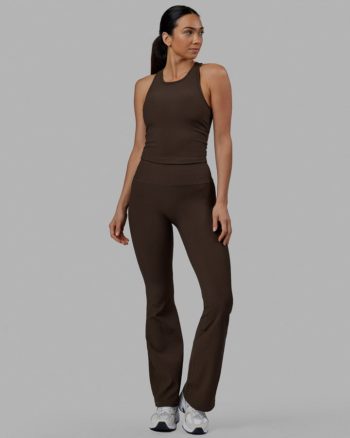Woman wearing Flow Ribbed Shelf Bra Performance Tank - Dark Chocolate