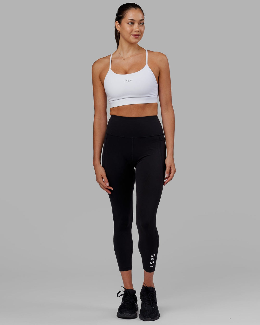 Woman wearing Flux Ultra High-Rise 7/8 Legging Pockets - Black