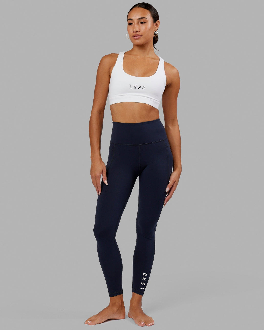 Woman wearing Flux Full Length Tight - Navy