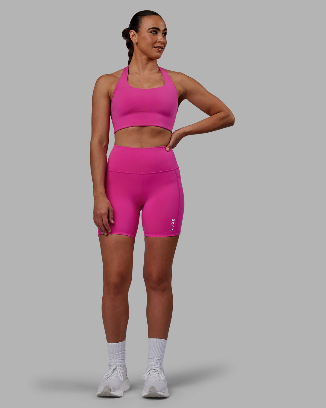 Woman wearing Flux Ultra High-Rise 6" Short Pockets - Fuchsia Pink