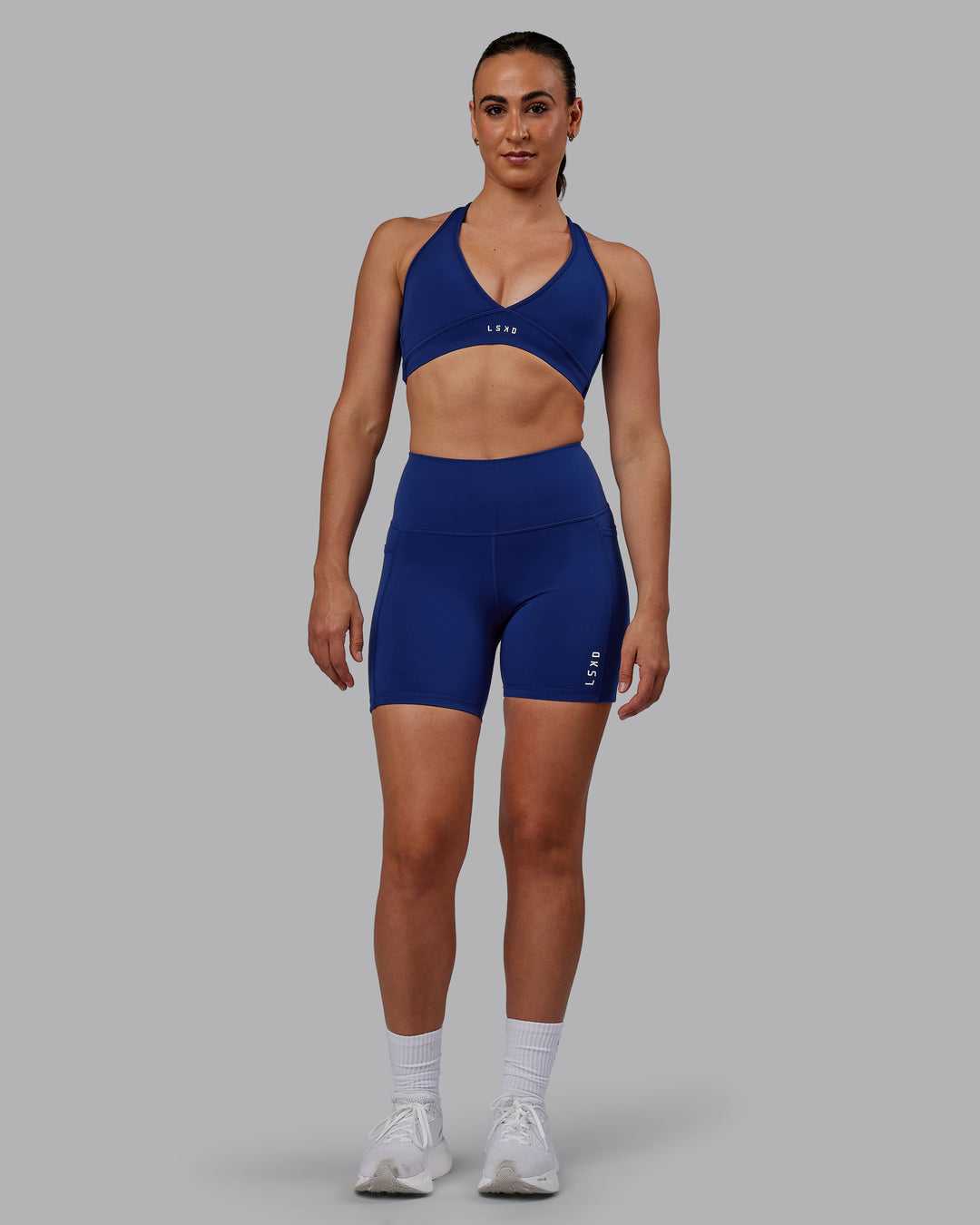 Woman wearing Flux Ultra High-Rise 6&quot; Short Pockets - Midnight Blue