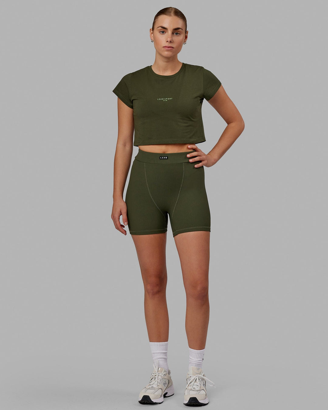 Woman wearing Front Runner Baby Tee - Forest Night