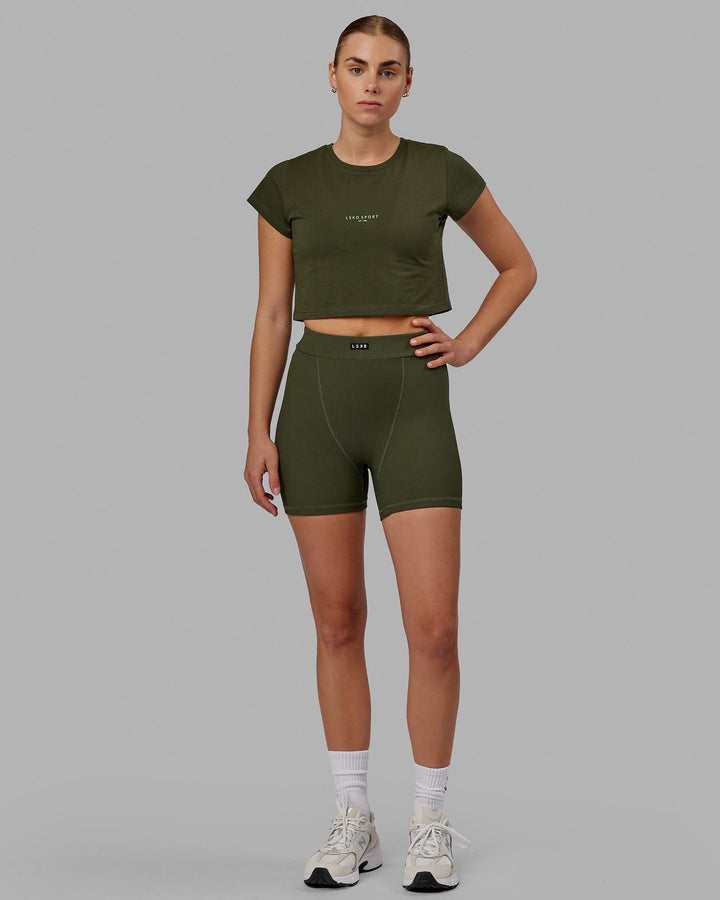 Woman wearing Front Runner Baby Tee - Forest Night