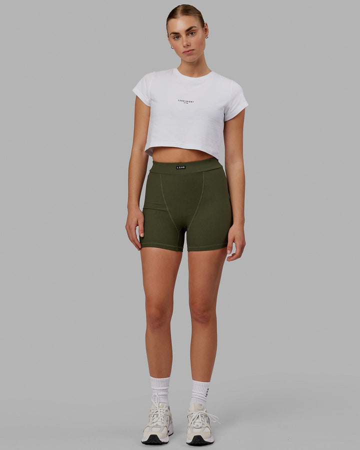 Woman wearing Front Runner Baby Tee - White