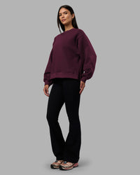 Woman wearing Full Form Fleece Sweater with Side Slits - Cherry Lacquer | Model:Rhiley | Size:S