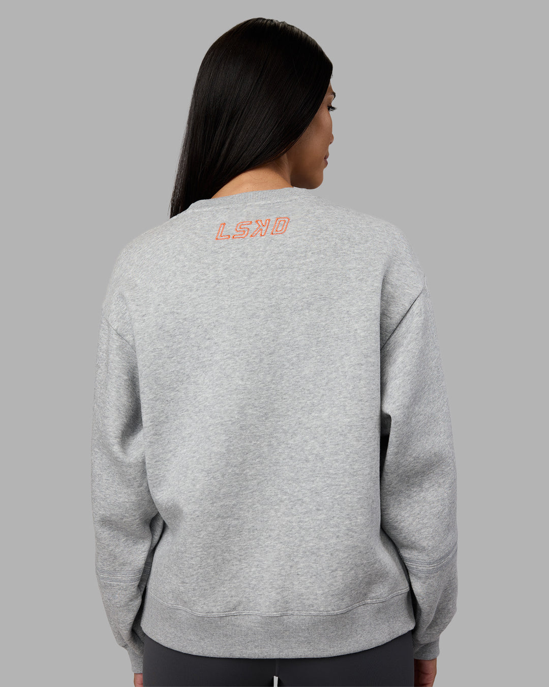 Woman wearing Full Form Fleece Sweater with Side Slits - Marl Grey | Model:Rhiley | Size:S