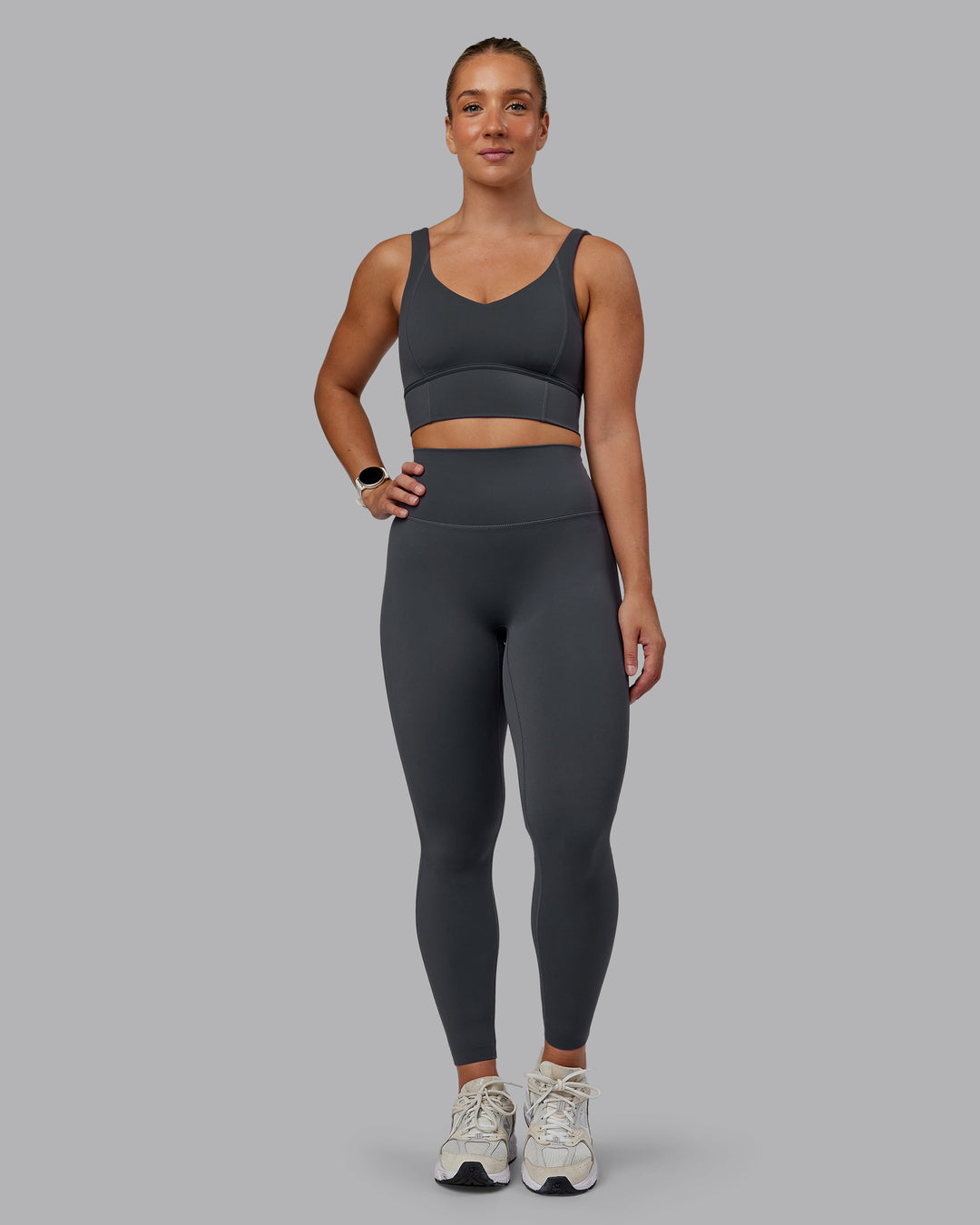 Woman wearing Function Longline Sports Bra in Dark Storm | Size:S