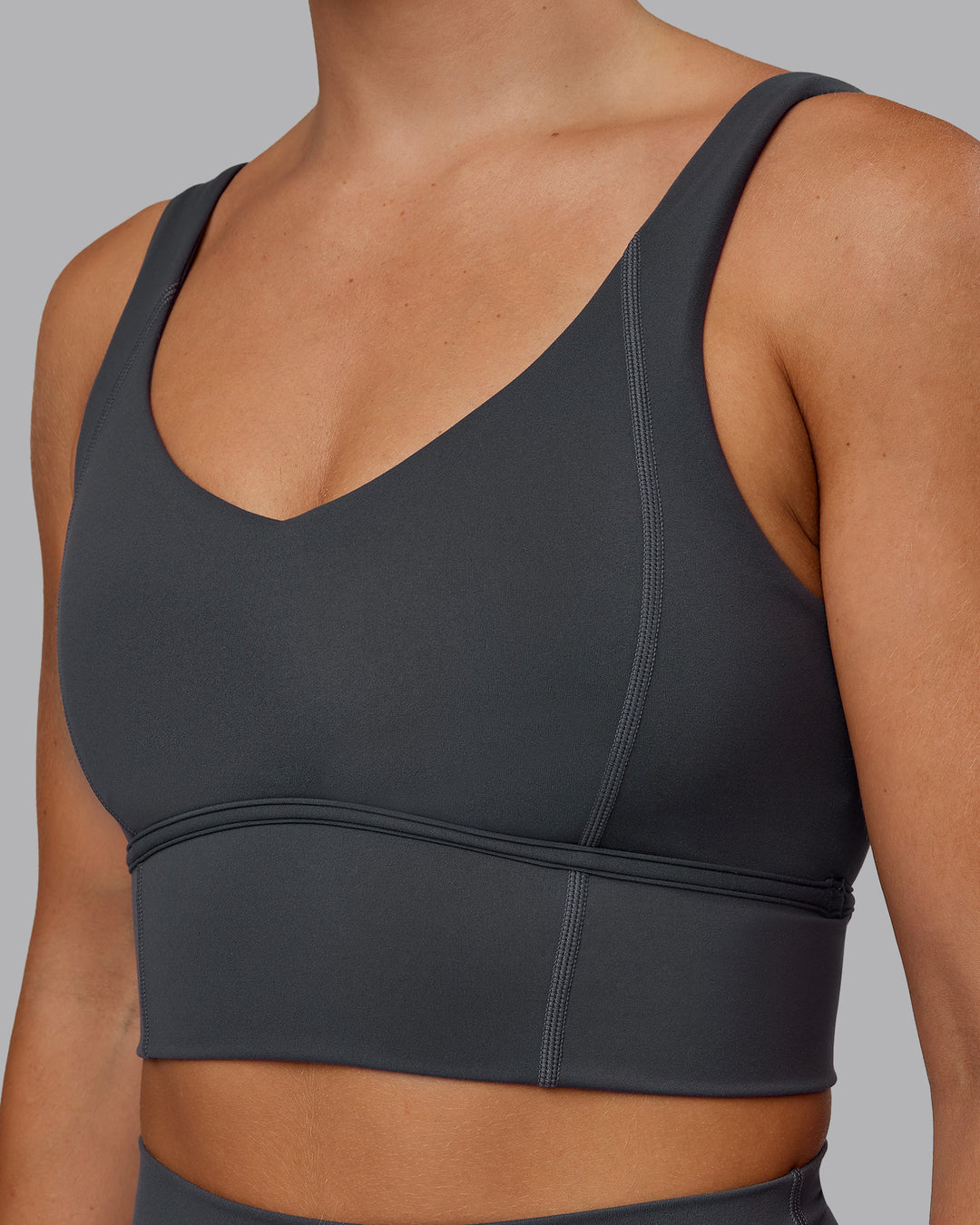 Woman wearing Function Longline Sports Bra in Dark Storm | Size:S
