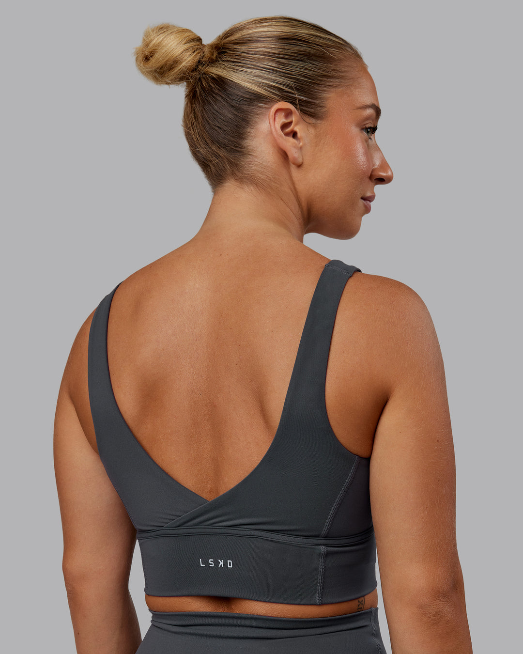 Woman wearing Function Longline Sports Bra in Dark Storm | Size:S