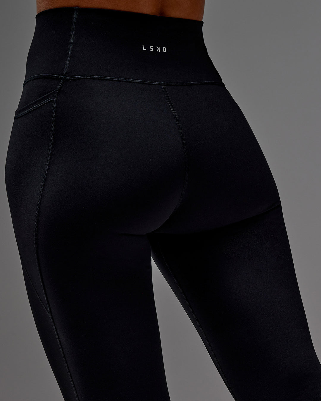 Woman wearing Fusion Ultra High-Rise 3/4 Legging Pockets - Black | Model:Demi | Size:S
