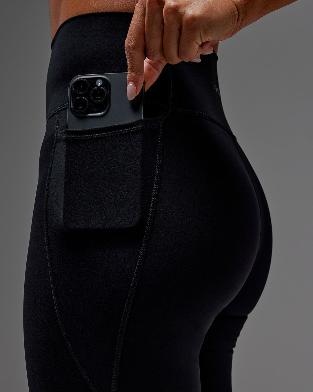 Woman wearing Fusion Ultra High-Rise 3/4 Legging Pockets - Black | Model:Demi | Size:S