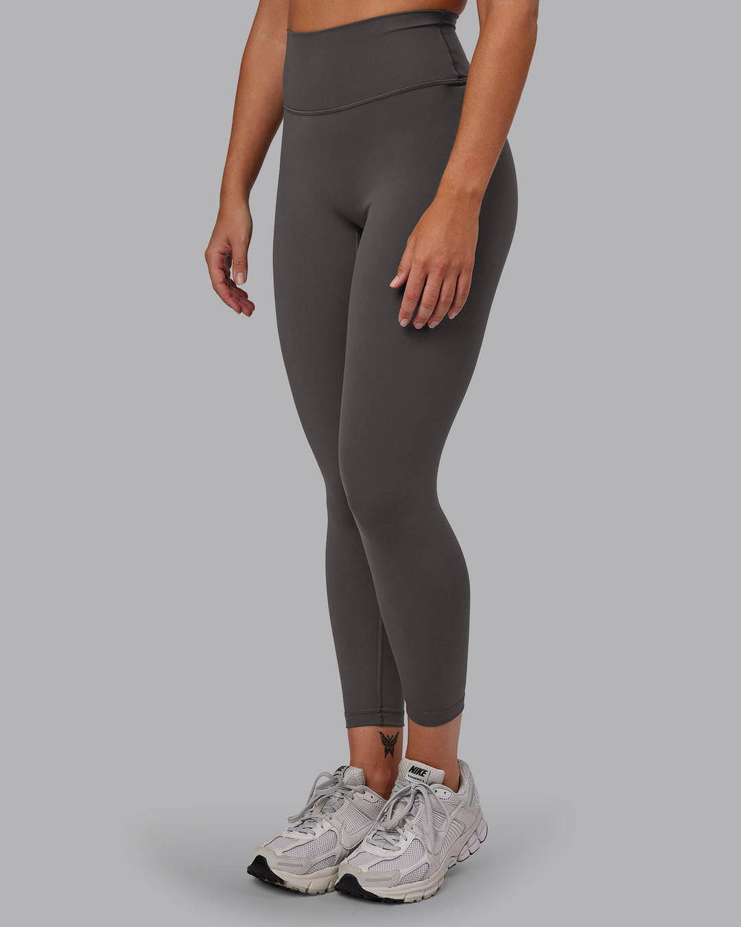 Woman wearing Fusion Ultra High-Rise 7/8 Legging - Dark Storm | Model:Hannah | Size:S