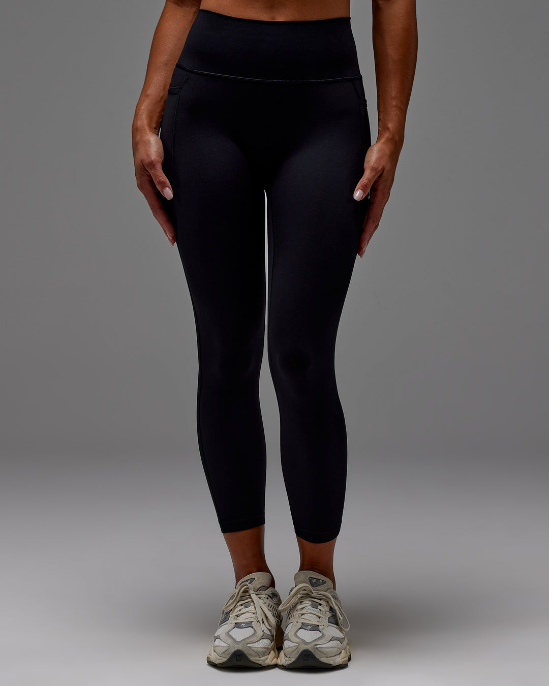 Woman wearing Fusion Ultra High-Rise 7/8 Legging Pockets - Black | Model:Demi | Size:S