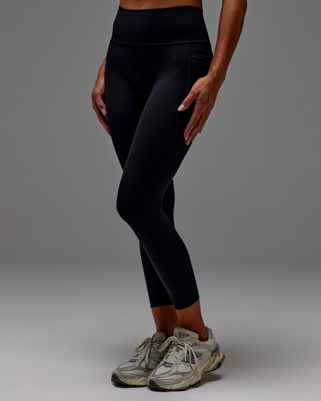Woman wearing Fusion Ultra High-Rise 7/8 Legging Pockets - Black | Model:Demi | Size:S