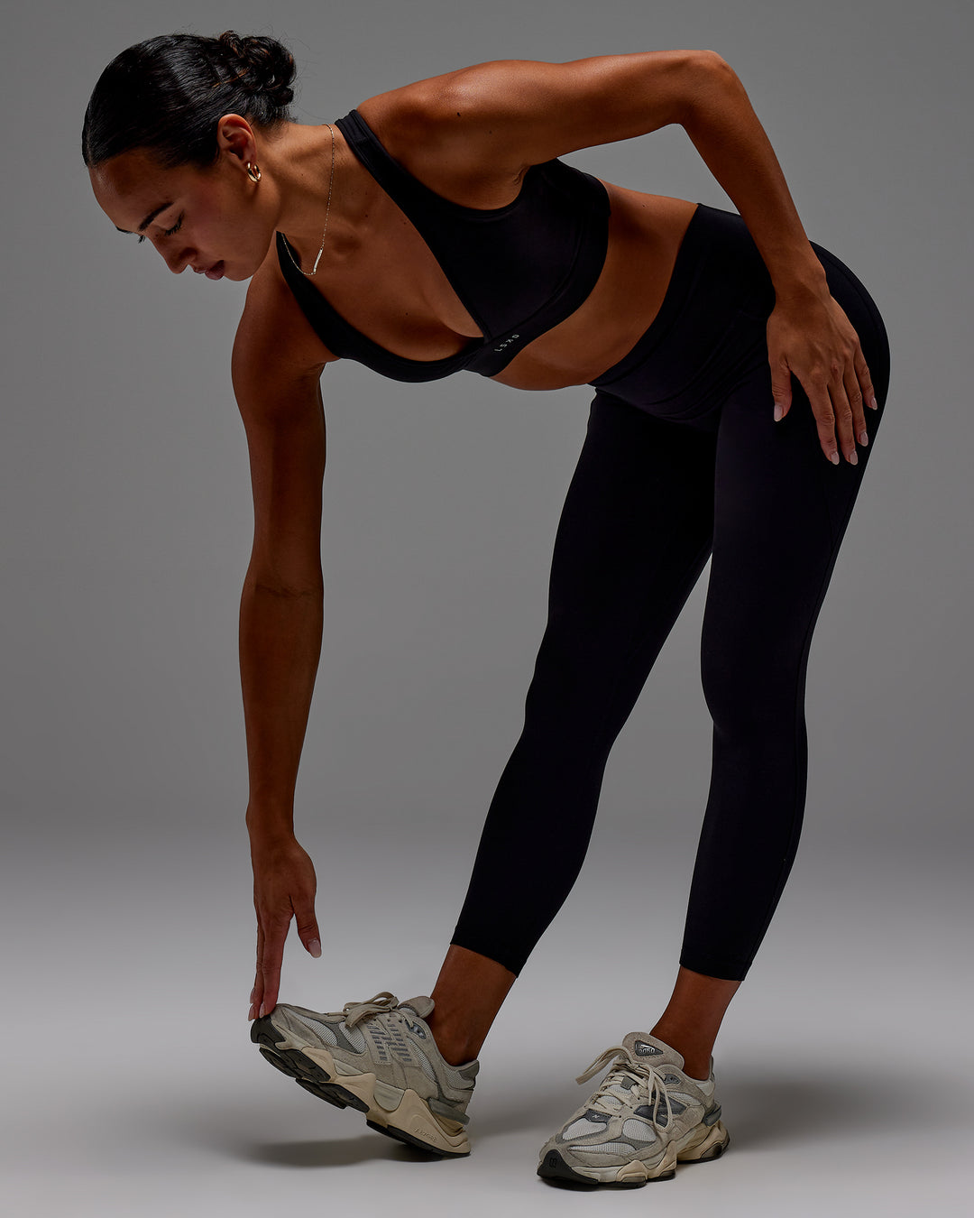 Woman wearing Fusion Ultra High-Rise 7/8 Legging Pockets - Black | Model:Demi | Size:S