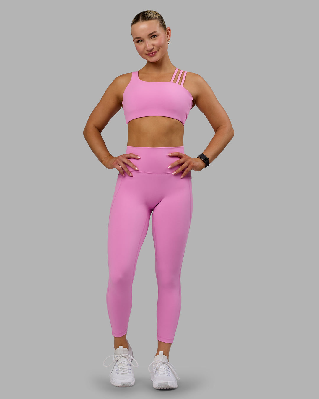 Woman wearing Fusion Ultra High-Rise 7/8 Legging Pockets - Spark Pink | Model:Halle | Size:S