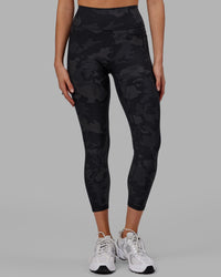 Woman wearing Fusion Ultra High-Rise 7/8 Legging Pockets - Black-Camo | Model:Katie | Size:S