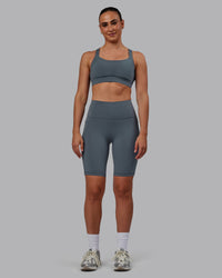 Woman wearing Fusion Ultra High-Rise 9" Short Pockets - Turbulence | Model:Sophie | Size:S | Thumbnail Index: 0