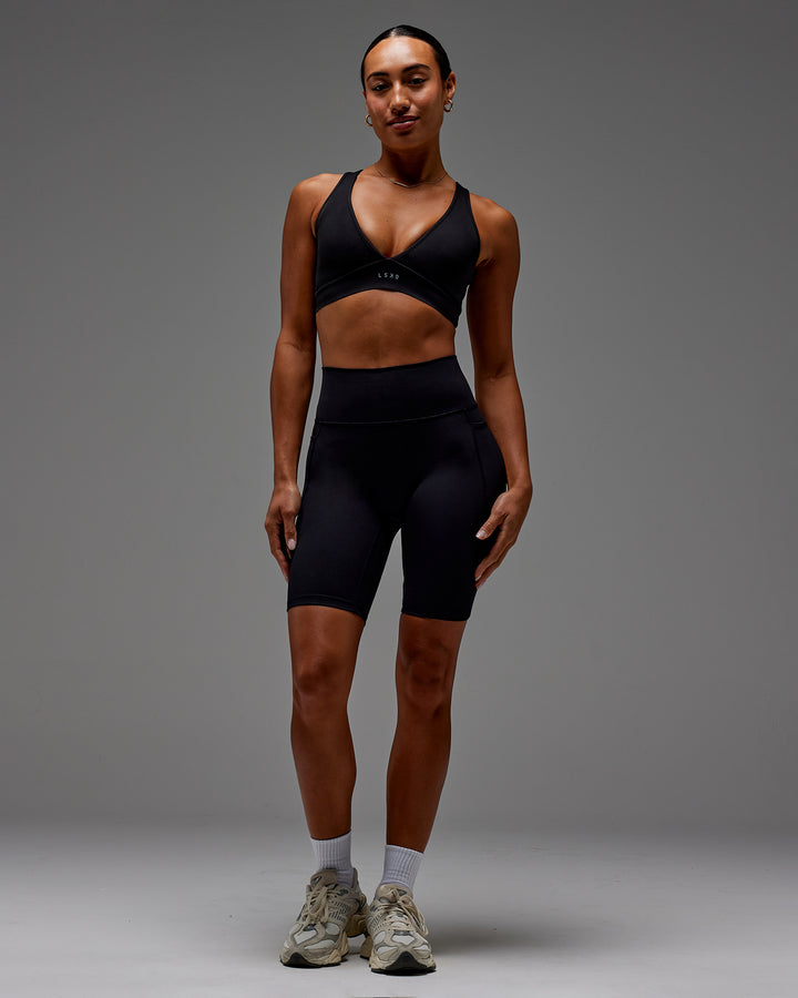 Woman wearing Fusion Bike Short With Pockets in Black | Model:Demi | Size:S
