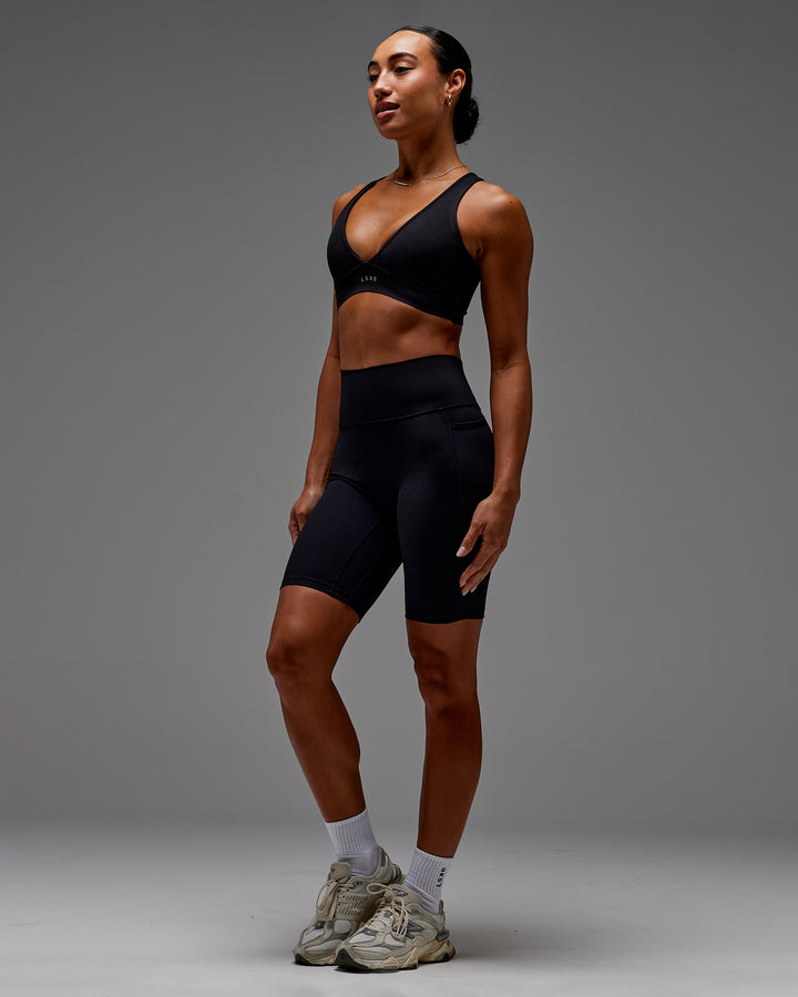 Woman wearing Fusion Bike Short With Pockets in Black | Model:Demi | Size:S
