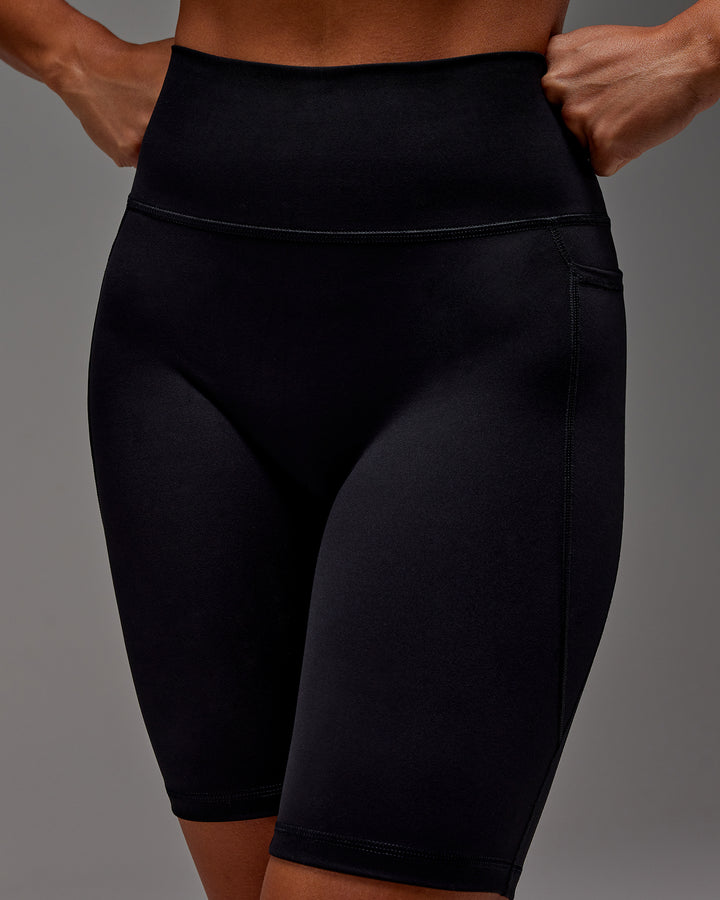 Woman wearing Fusion Bike Short With Pockets in Black | Model:Demi | Size:S
