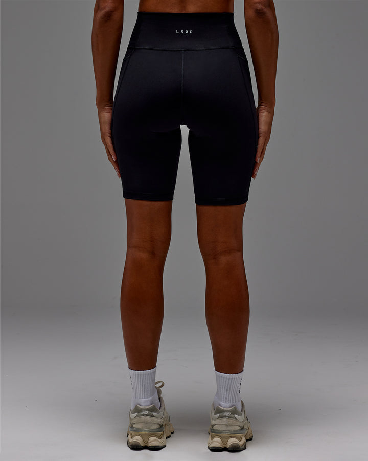 Woman wearing Fusion Bike Short With Pockets in Black | Model:Demi | Size:S
