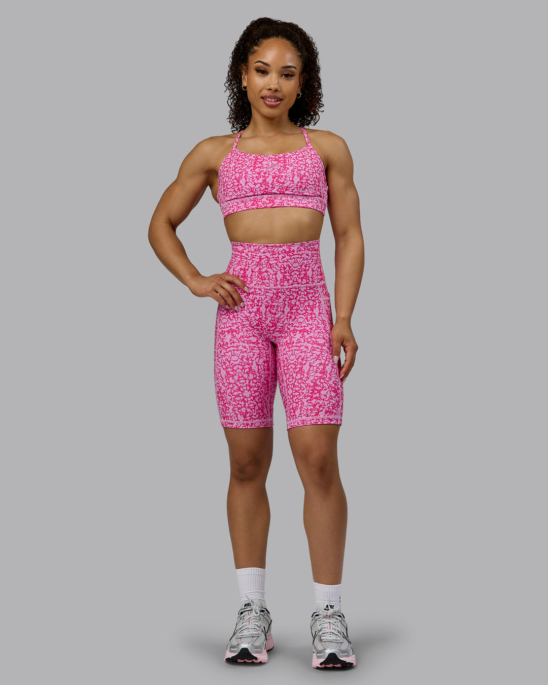 Woman wearing Fusion Ultra High-Rise 9&quot; Short Pockets - Patina-Ultra Pink | Model:Tarnie | Size:S