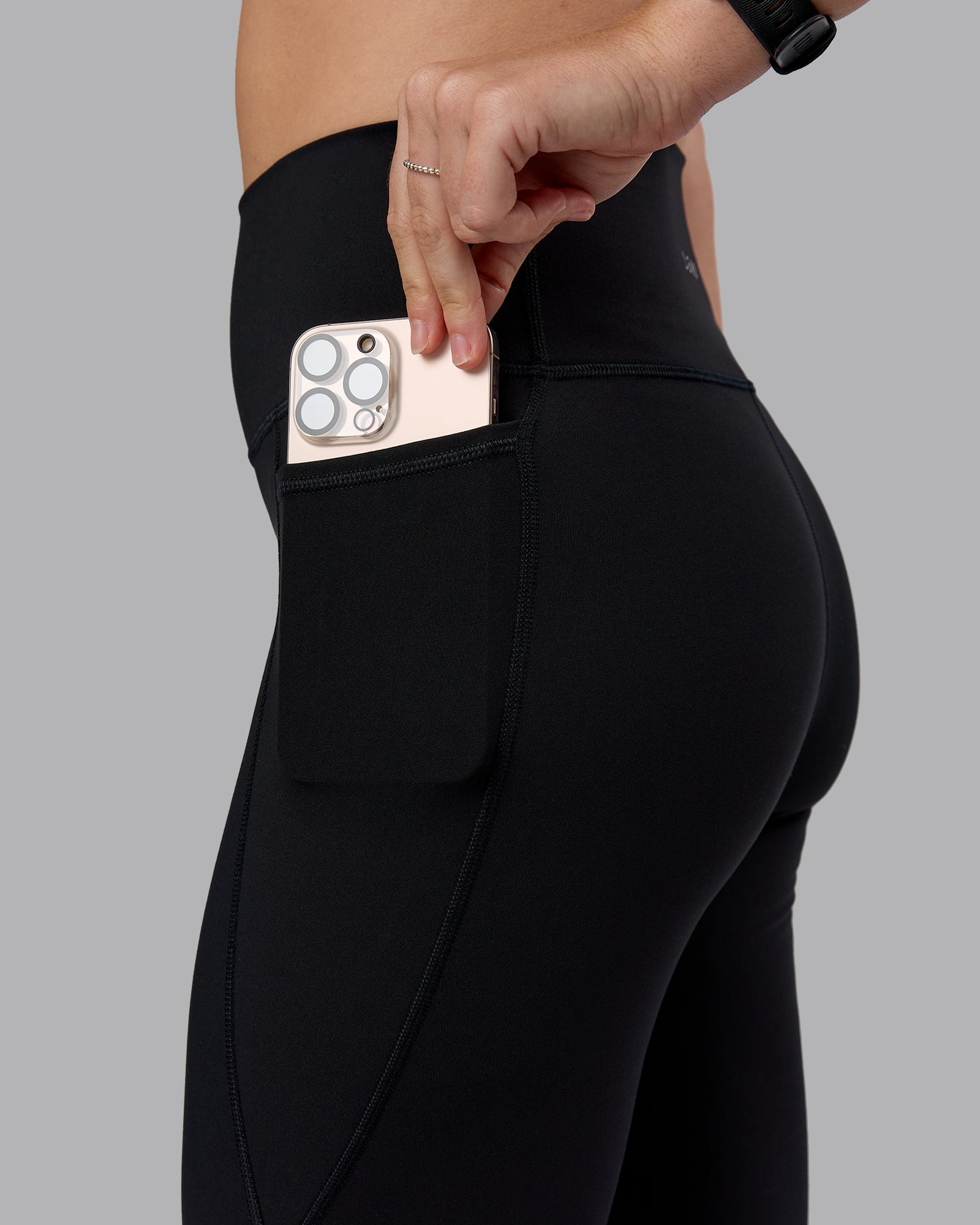 Woman wearing Fusion Ultra High-Rise Flared Petite Legging Pockets - Black| Model:Bianca | Size:S