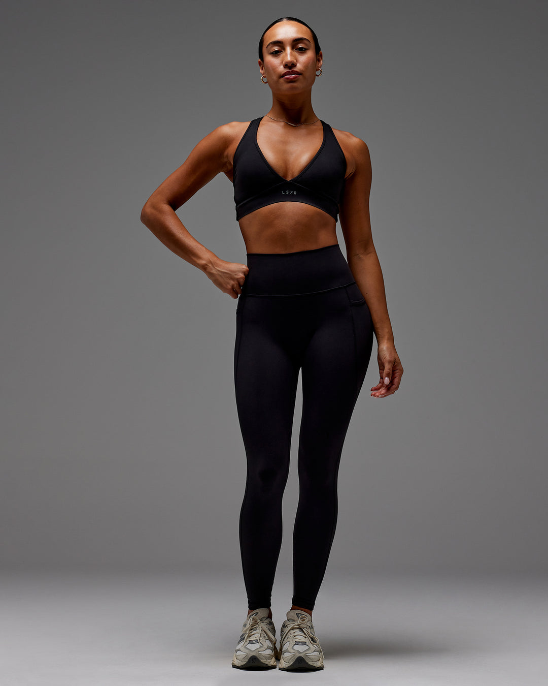 Woman wearing Fusion Ultra High-Rise Full Length Legging Pockets - Black | Model:Demi | Size:S