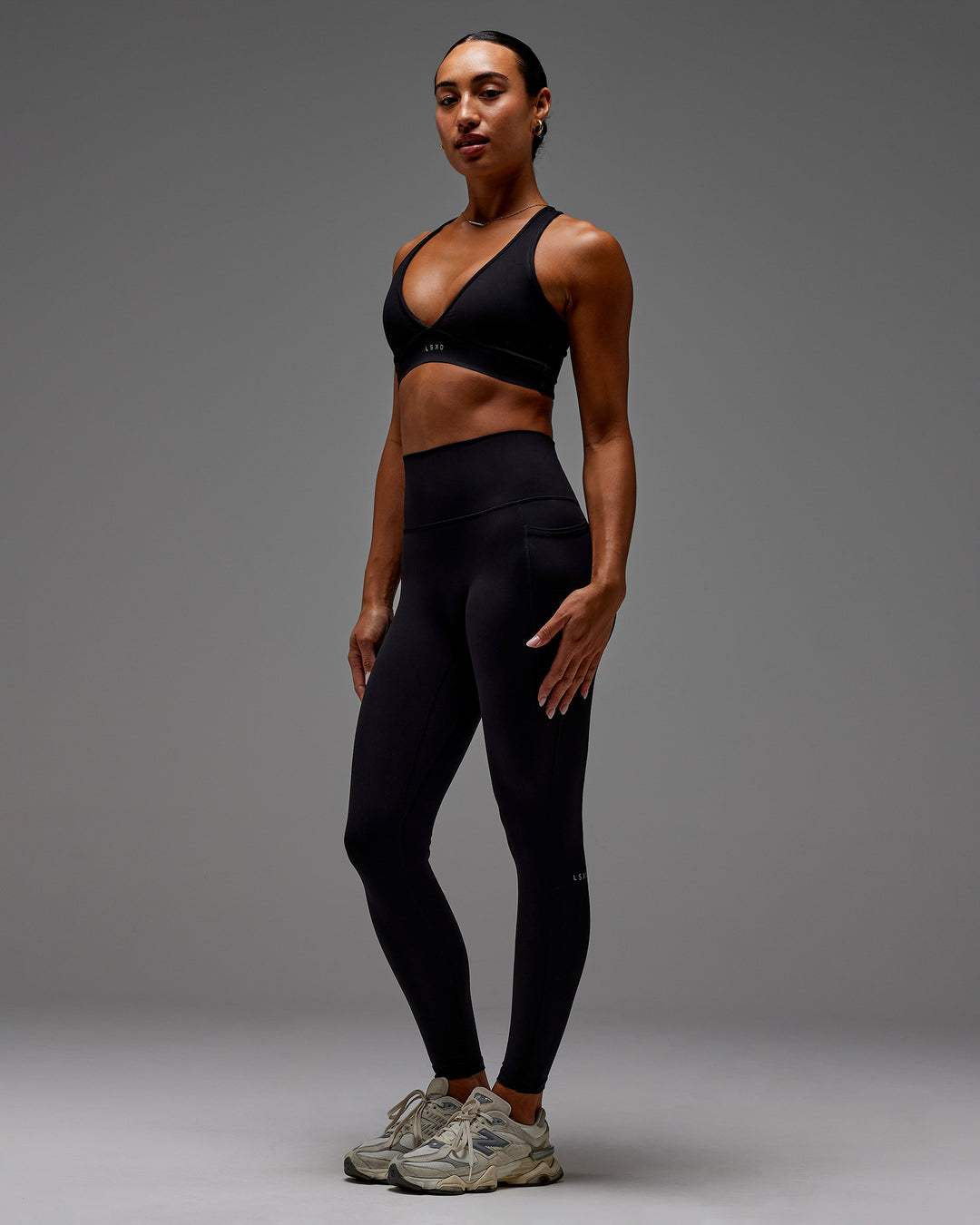 Woman wearing Fusion Ultra High-Rise Full Length Legging Pockets - Black | Model:Demi | Size:S