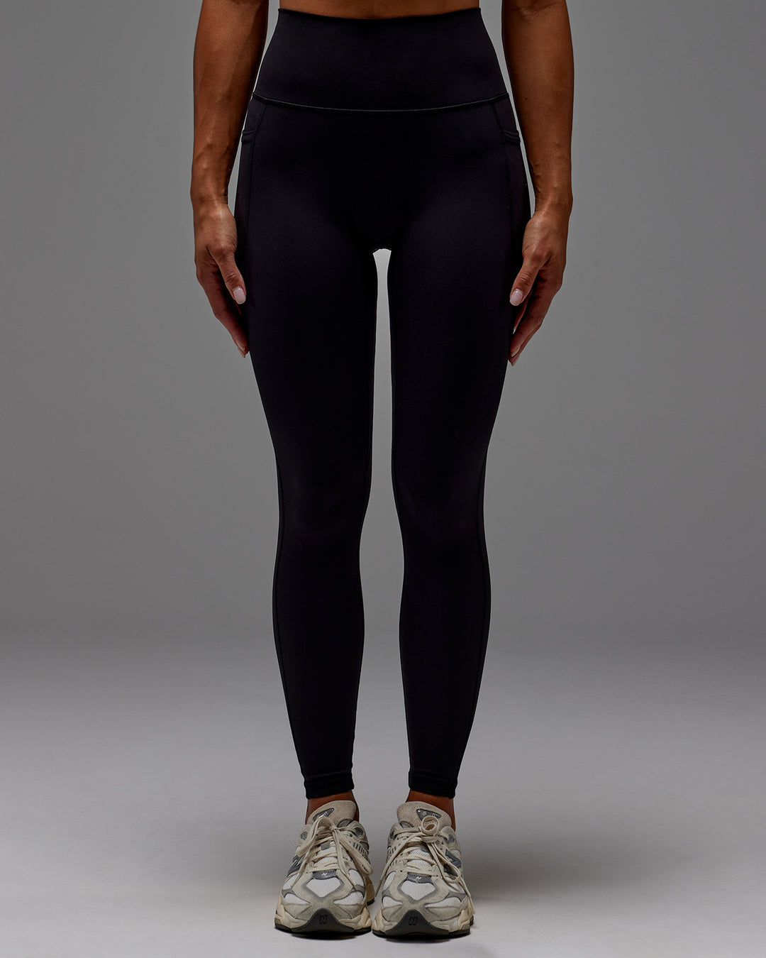 Woman wearing Fusion Ultra High-Rise Full Length Legging Pockets - Black | Model:Demi | Size:S