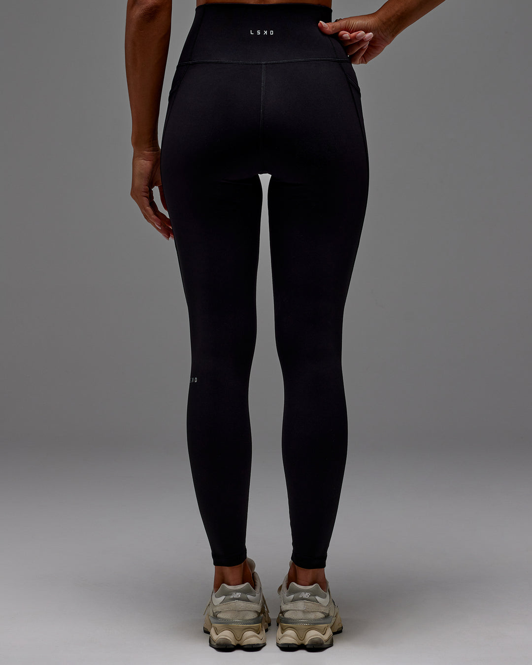 Woman wearing Fusion Ultra High-Rise Full Length Legging Pockets - Black | Model:Demi | Size:S
