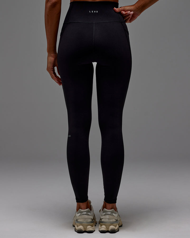 Woman wearing Fusion Full Length Tight With Pockets in Black | Model:Demi | Size:S
