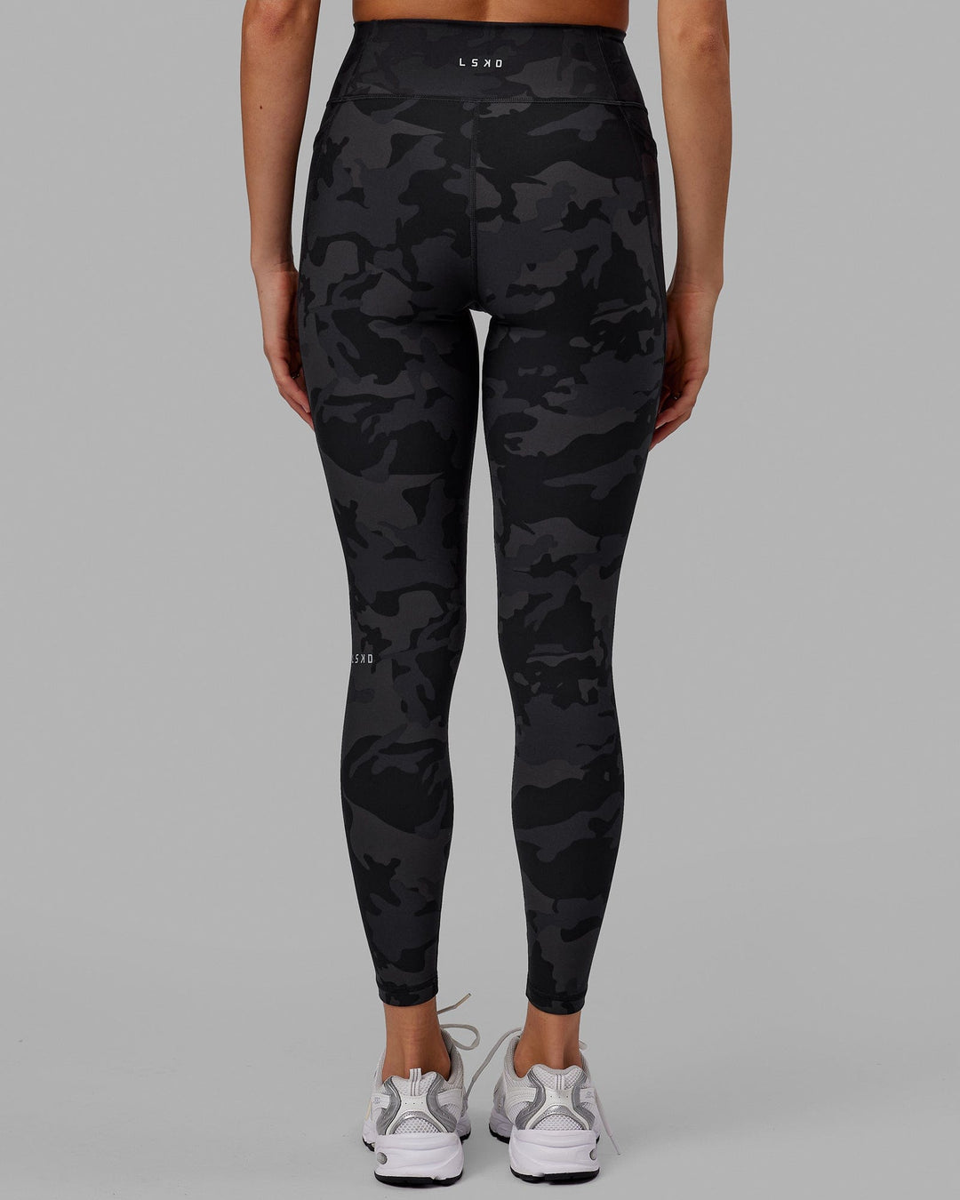 Woman wearing Fusion Ultra High-Rise Full Length Legging Pockets - Black Camo | Model:Katie | Size:S